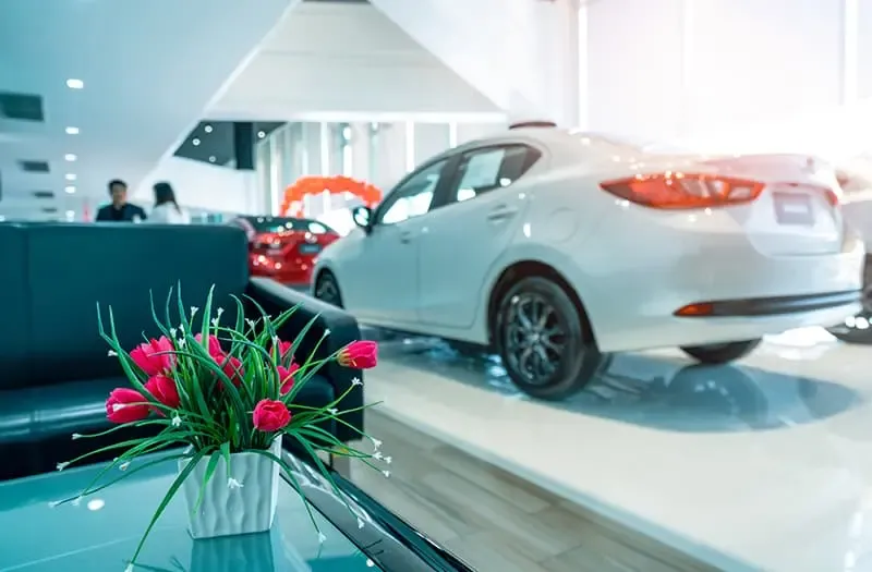 A clean and well-organized car showroom with polished floors
