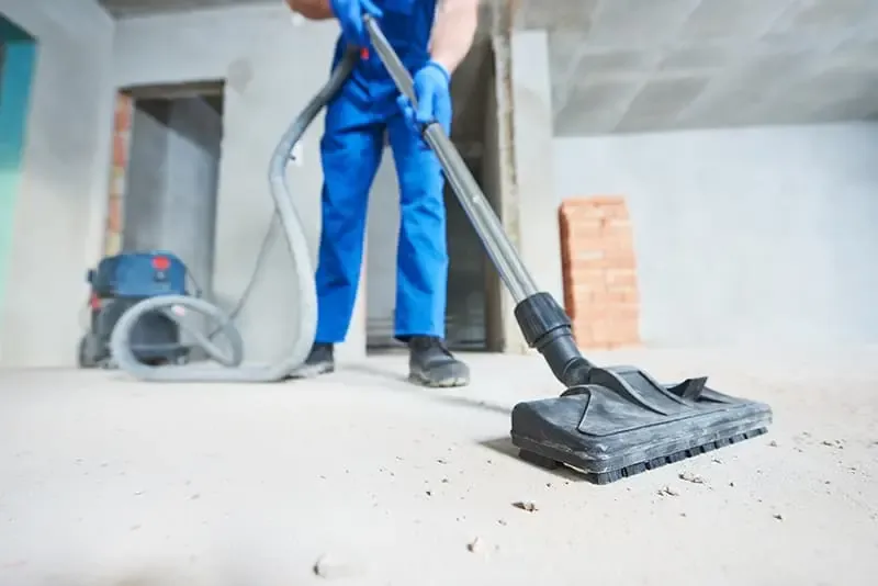 Post-construction cleaning in progress after a new build